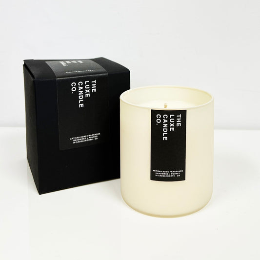 Luxury soy wax candle with palo santo scent fragrance in minimal contemporary pigment rich coloured glass jar