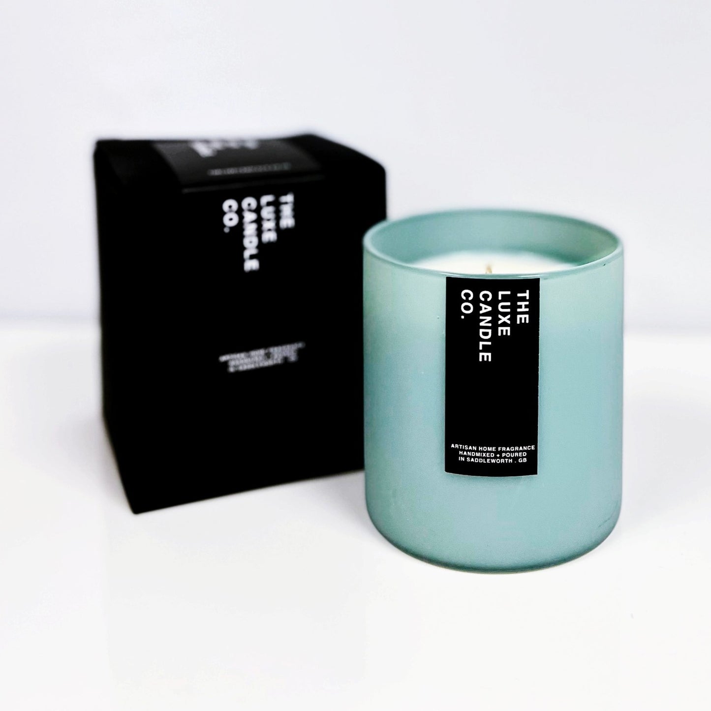 Luxury soy wax candle with MINT + WHITE TEA scent fragrance in minimal contemporary pigment rich coloured glass jar
