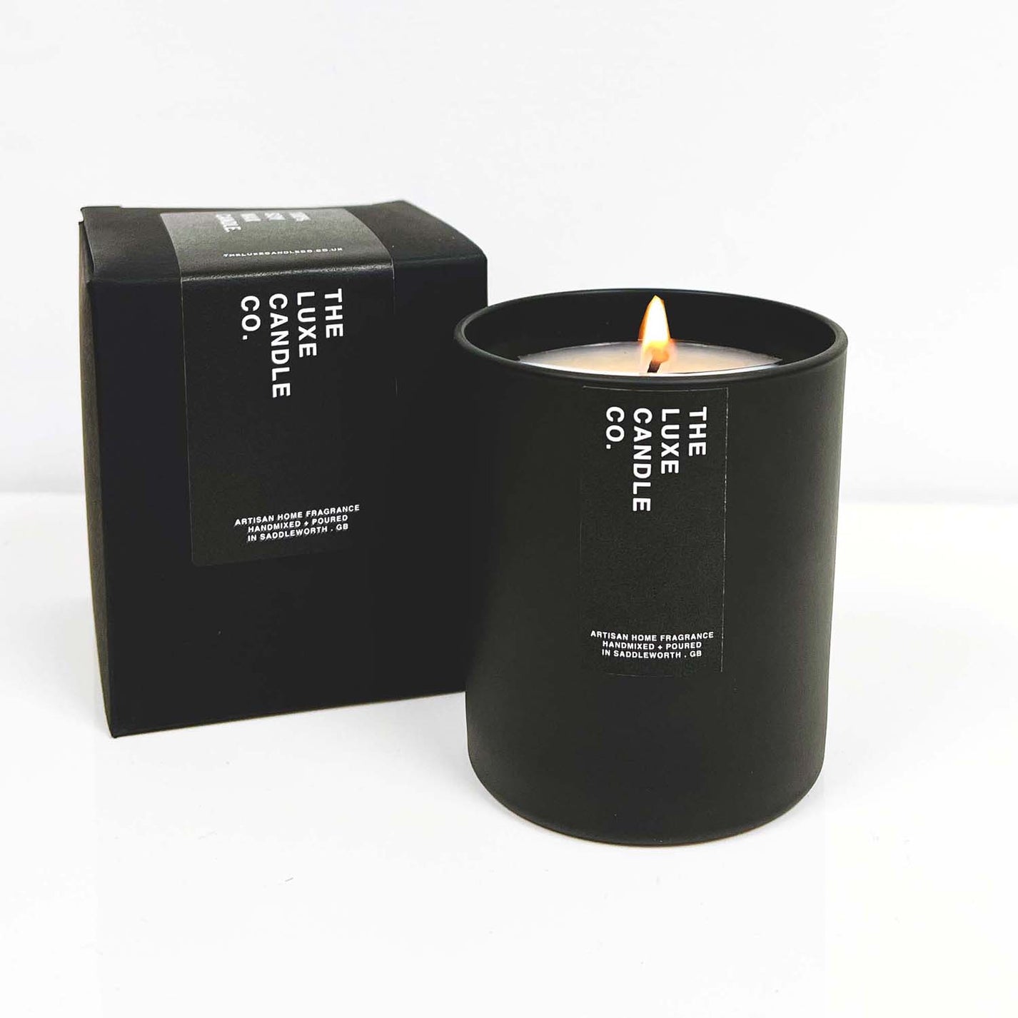Luxury soy wax candle with patchouli scent fragrance in black glass jar